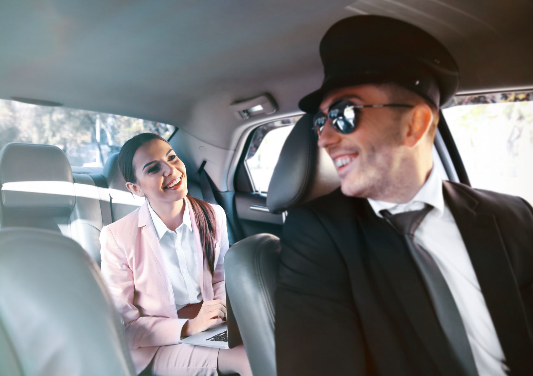 Businesswoman getting airport taxi transfer to Geneva airport