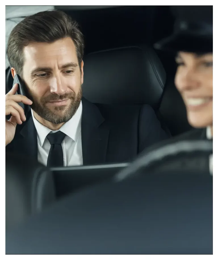 Businessman in luxury car with private chauffeur - Geneva car services